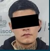 Ficha de detención de la Fiscalía de Jalisco de Adrián 'N' con una imagen del detenido con los ojos censurados por un recuadro negro