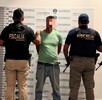 Luis Fidel ‘N' con a cara censurada siendo detenido por agentes de la Fiscalía de Michoacán, Guardia Nacional, Ejército Mexicano y Guardia Civil