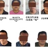 once personas detenidas con los ojos cubiertos