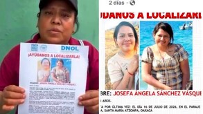 Muejer sosteniendo una ficha de búsqueda de una persona desaparecida.