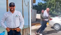 David Escalante, director de Prolimpia, y un trabajador del Sistema Municipal de Agua Potable y Alcantarillado de Progreso peleando