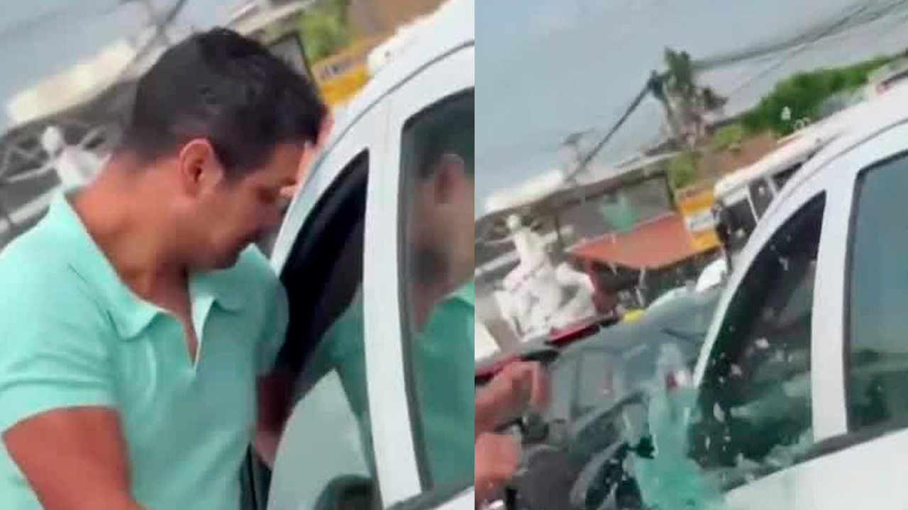 Captan a hombre rompiendo cristal de un auto durante pelea vial en Puebla