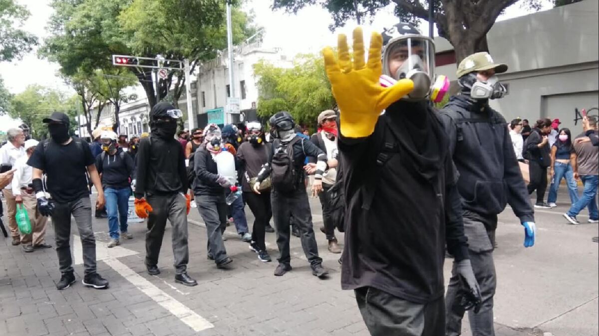 Manifestantes reprocharon la presencia de encapuchados en la movilización.