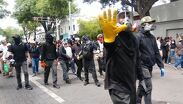 Manifestantes reprocharon la presencia de encapuchados en la movilización.